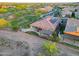 Scenic aerial view of the home featuring solar panels, a large patio with outdoor furniture, and landscaped yard at 13236 W Montansoro Ln, Peoria, AZ 85383