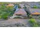 Gorgeous aerial view showcasing the home's solar panels, outdoor patio, landscaping, and location in a friendly neighborhood at 13236 W Montansoro Ln, Peoria, AZ 85383