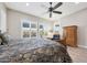 Bedroom showcasing a large bed and shuttered windows offering natural light and outdoor views at 13236 W Montansoro Ln, Peoria, AZ 85383