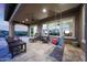 Enjoy the covered patio with comfortable seating, swing and views at 13236 W Montansoro Ln, Peoria, AZ 85383