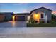 Charming home with a brick driveway, well-maintained yard, and professional landscaping, set in a cozy community at 13236 W Montansoro Ln, Peoria, AZ 85383