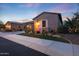 Charming single-story home with desert landscaping and a tile roof at twilight at 13236 W Montansoro Ln, Peoria, AZ 85383