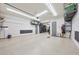 Large, organized garage with epoxy floors, overhead storage, and ample room for parking at 13236 W Montansoro Ln, Peoria, AZ 85383