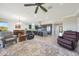 Open-concept living room showcasing a modern kitchen with a large island and stainless steel appliances at 13236 W Montansoro Ln, Peoria, AZ 85383