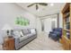 Relaxing living room featuring comfortable seating, neutral decor and lots of natural light at 13236 W Montansoro Ln, Peoria, AZ 85383