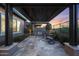 Outdoor kitchen and dining area featuring a built-in grill, perfect for entertaining at 13236 W Montansoro Ln, Peoria, AZ 85383