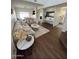Spacious living room with plush sectional sofa, stylish rug, and modern decor at 13443 W Crocus Dr, Surprise, AZ 85379