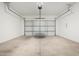 Spacious two-car garage with an automatic door, providing secure parking and storage at 14045 W Desert Flower Dr, Goodyear, AZ 85395