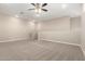 Large living room featuring a ceiling fan, providing a comfortable and airy space at 14045 W Desert Flower Dr, Goodyear, AZ 85395