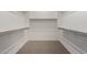 Spacious walk-in closet featuring shelves and a hanging rod for optimal storage at 14045 W Desert Flower Dr, Goodyear, AZ 85395