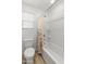 Bathroom featuring a white shower-tub combo with floral shower curtain at 14435 W El Cortez Pl, Surprise, AZ 85387