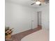 Cozy bedroom featuring plush carpeting and a modern ceiling fan at 14435 W El Cortez Pl, Surprise, AZ 85387