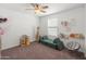 Bright bedroom with natural light, play couch, and fun decor at 14435 W El Cortez Pl, Surprise, AZ 85387