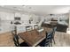 Dining area adjacent to a kitchen with a view into the living room at 14435 W El Cortez Pl, Surprise, AZ 85387