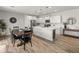 Open concept kitchen and dining area with modern decor and natural light at 14435 W El Cortez Pl, Surprise, AZ 85387