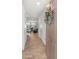 Open entryway with wood-look flooring, wreath, and view into the living space at 14435 W El Cortez Pl, Surprise, AZ 85387