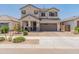 Charming two-story home featuring desert landscaping and a welcoming front porch at 14435 W El Cortez Pl, Surprise, AZ 85387