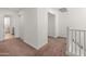 Upstairs hallway with neutral walls and carpeting at 14435 W El Cortez Pl, Surprise, AZ 85387