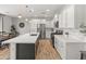 Spacious kitchen featuring a large island, stainless steel appliances, and ample cabinet space at 14435 W El Cortez Pl, Surprise, AZ 85387