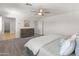 Bright main bedroom showcasing neutral color palette and a ceiling fan at 14435 W El Cortez Pl, Surprise, AZ 85387