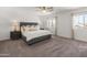 Main bedroom with plush carpet and dual windows at 14435 W El Cortez Pl, Surprise, AZ 85387