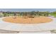 Community playground featuring slides, swings, and climbing structures, great for outdoor fun and recreation at 14435 W El Cortez Pl, Surprise, AZ 85387