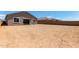 Large backyard offering numerous possibilities for creating an outdoor living space or garden area at 15833 W Bronco Trl, Surprise, AZ 85387