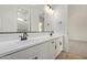 Bright bathroom featuring double vanity, tile flooring, and an ensuite bathroom at 15833 W Bronco Trl, Surprise, AZ 85387