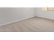 Bright bedroom featuring neutral carpet, white walls, and a window providing natural light at 15833 W Bronco Trl, Surprise, AZ 85387