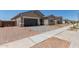 Charming single-Gathering home with a two-car garage, neutral colors, and a well-maintained landscape at 15833 W Bronco Trl, Surprise, AZ 85387