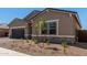 Charming single-Gathering home with a two-car garage, neutral colors, and a well-maintained landscape at 15833 W Bronco Trl, Surprise, AZ 85387
