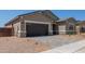 Charming single-Gathering home with a two-car garage, neutral colors, and a well-maintained landscape at 15833 W Bronco Trl, Surprise, AZ 85387