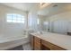 This bathroom includes a soaking tub and large mirror at 18174 E Via Jardin --, Gold Canyon, AZ 85118