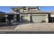 Inviting two-story home featuring a two-car garage and a well-maintained front yard at 18174 E Via Jardin --, Gold Canyon, AZ 85118