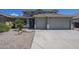Charming home featuring a two-car garage, desert landscaping, and a tile roof on a sunny day at 18174 E Via Jardin --, Gold Canyon, AZ 85118