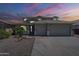 Two-story home with a three-car garage, desert landscaping, and neutral paint at 18174 E Via Jardin --, Gold Canyon, AZ 85118