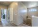 Well-lit hallway with modern flooring leads to multiple rooms on the upper level at 18174 E Via Jardin --, Gold Canyon, AZ 85118