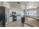 Well-lit kitchen boasting stainless steel appliances, ample counter space, and modern finishes at 18174 E Via Jardin --, Gold Canyon, AZ 85118