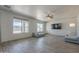 Open living room features lots of natural light, modern flooring, and comfortable seating at 18174 E Via Jardin --, Gold Canyon, AZ 85118