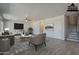 Spacious living room with wood floors, ceiling fan, and neutral color palette at 18174 E Via Jardin --, Gold Canyon, AZ 85118