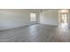 Open-concept living area with light gray walls, modern floors, and plenty of natural light at 18174 E Via Jardin --, Gold Canyon, AZ 85118