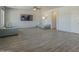 Bright living room with modern flooring, ceiling fan, and neutral décor offers versatile living space at 18174 E Via Jardin --, Gold Canyon, AZ 85118
