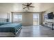 This main bedroom features a ceiling fan, balcony, and mountain views at 18174 E Via Jardin --, Gold Canyon, AZ 85118