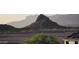 A mountain view lot features a new block wall and views of mountains, near new home construction at 18174 E Via Jardin --, Gold Canyon, AZ 85118