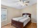 Cozy bedroom featuring a wooden bed frame and a window providing natural light at 201 S Greenfield Rd # 173, Mesa, AZ 85206