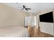 Bright bedroom with wood laminate flooring features an adjacent hallway at 201 S Greenfield Rd # 173, Mesa, AZ 85206