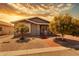 Well-maintained single-story home with desert landscaping and inviting front entrance at 201 S Greenfield Rd # 173, Mesa, AZ 85206