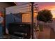 A hot tub area with a privacy screen and sunset views creates a relaxing retreat at 201 S Greenfield Rd # 173, Mesa, AZ 85206