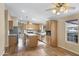 Bright kitchen with stainless steel appliances, center island, and light wood cabinetry at 201 S Greenfield Rd # 173, Mesa, AZ 85206