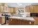 Bright kitchen featuring light wood cabinets, tile countertops, and stainless steel appliances at 201 S Greenfield Rd # 173, Mesa, AZ 85206